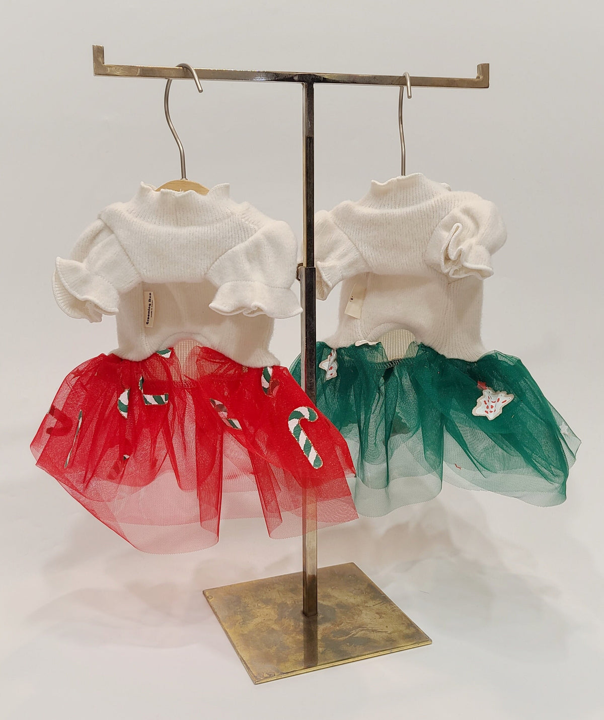 NKpup Christmas dog tutu dresses in white knit with red or green tulle skirts and candy cane patterns.