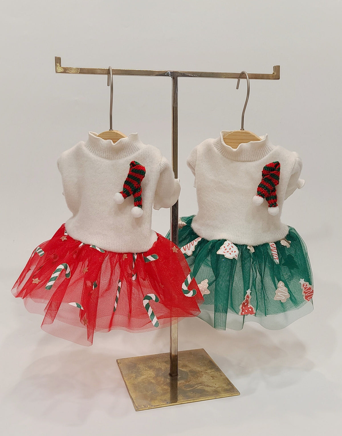 NKpup Christmas dog tutu dresses in red and green with candy cane patterns and knit stockings.