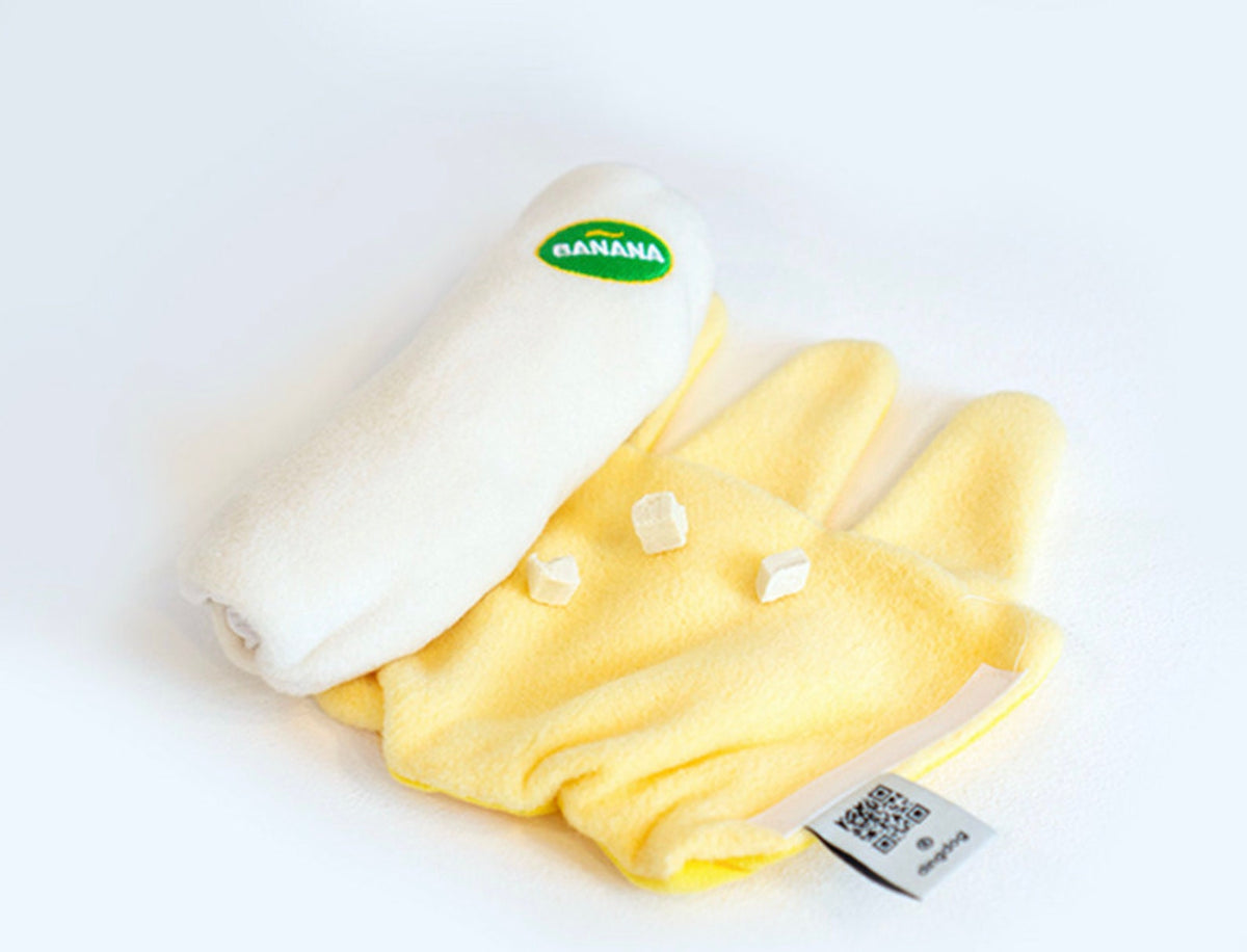 Yellow and white Snuffle Banana dog toy with soft plush fabric for interactive play.