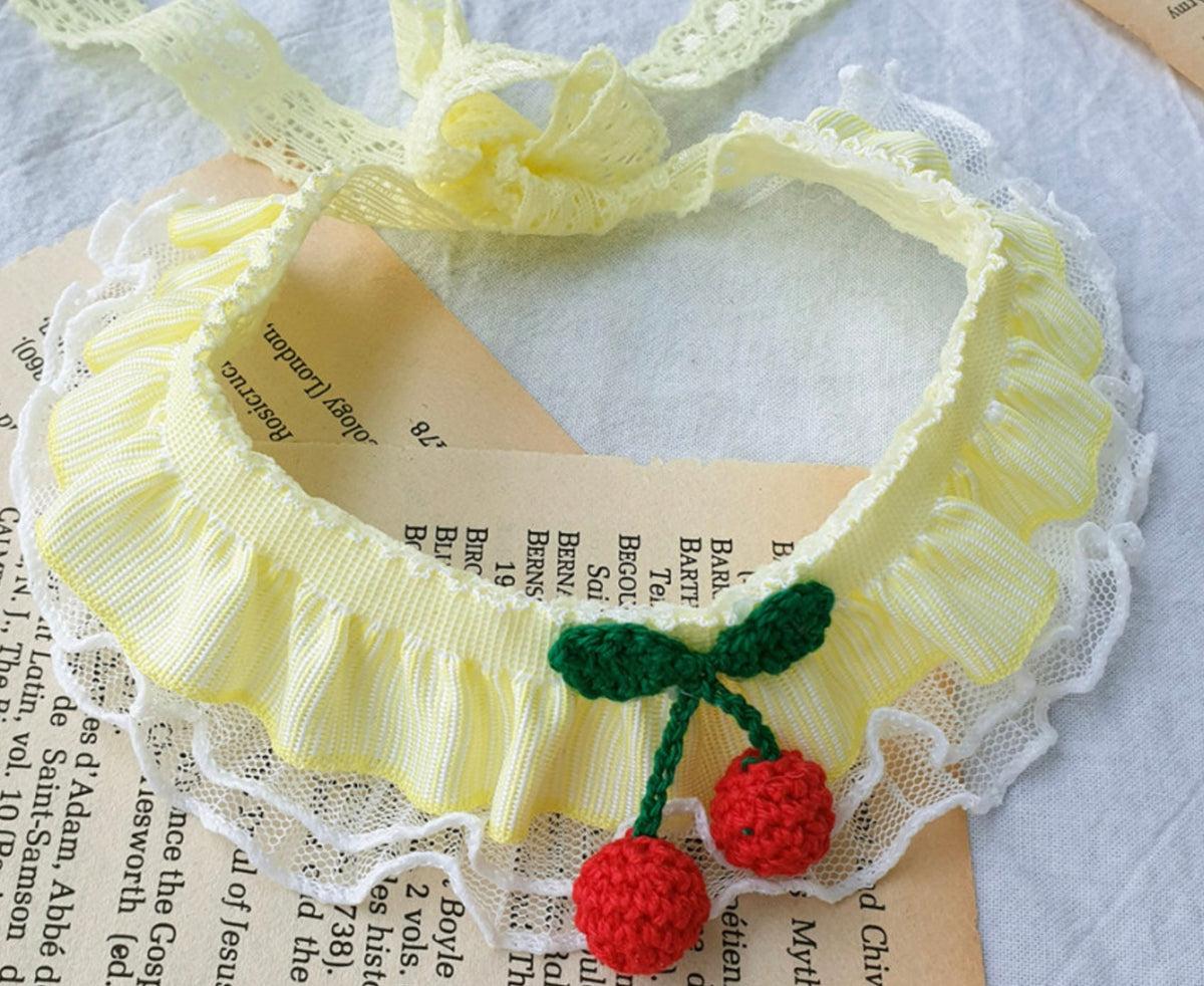 Cherry Lace Dog Cape in pale yellow with red cherry applique and white lace trim