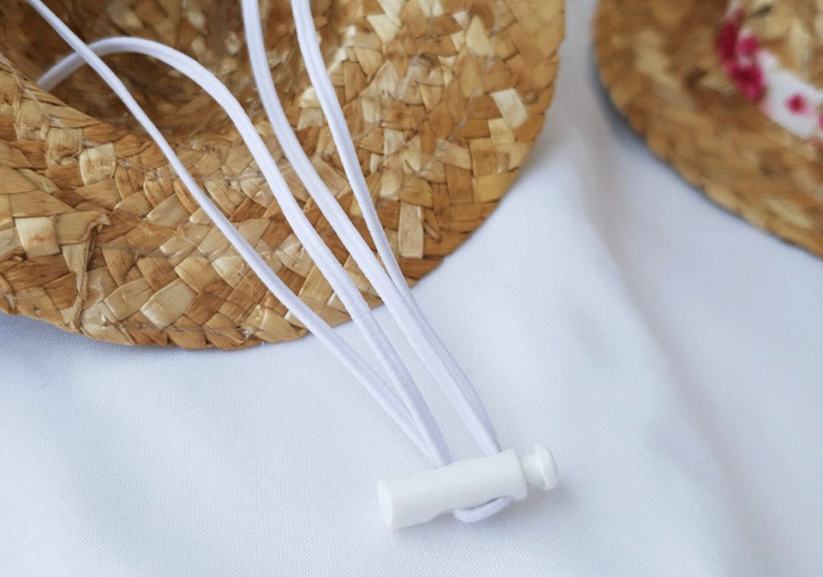 White adjustable drawstring cord for a straw ribbon dog hat by NKpup