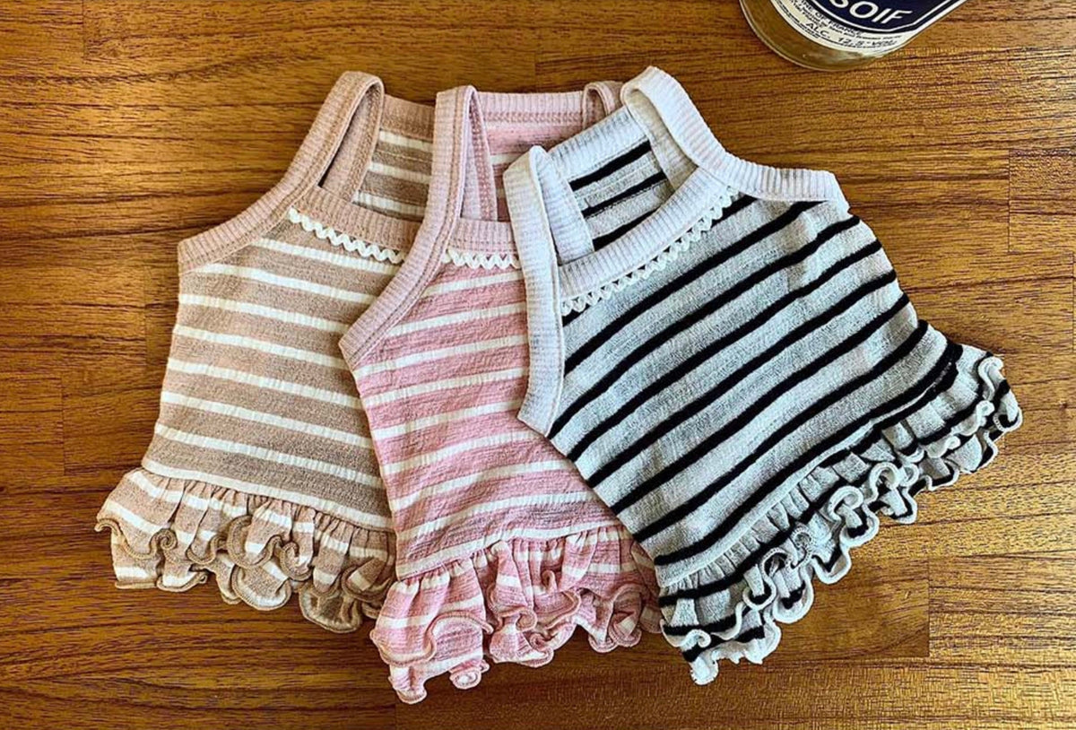 NKpup Stripe Crop Sleeveless Top dog shirts in beige, pink, and white with ruffle hems
