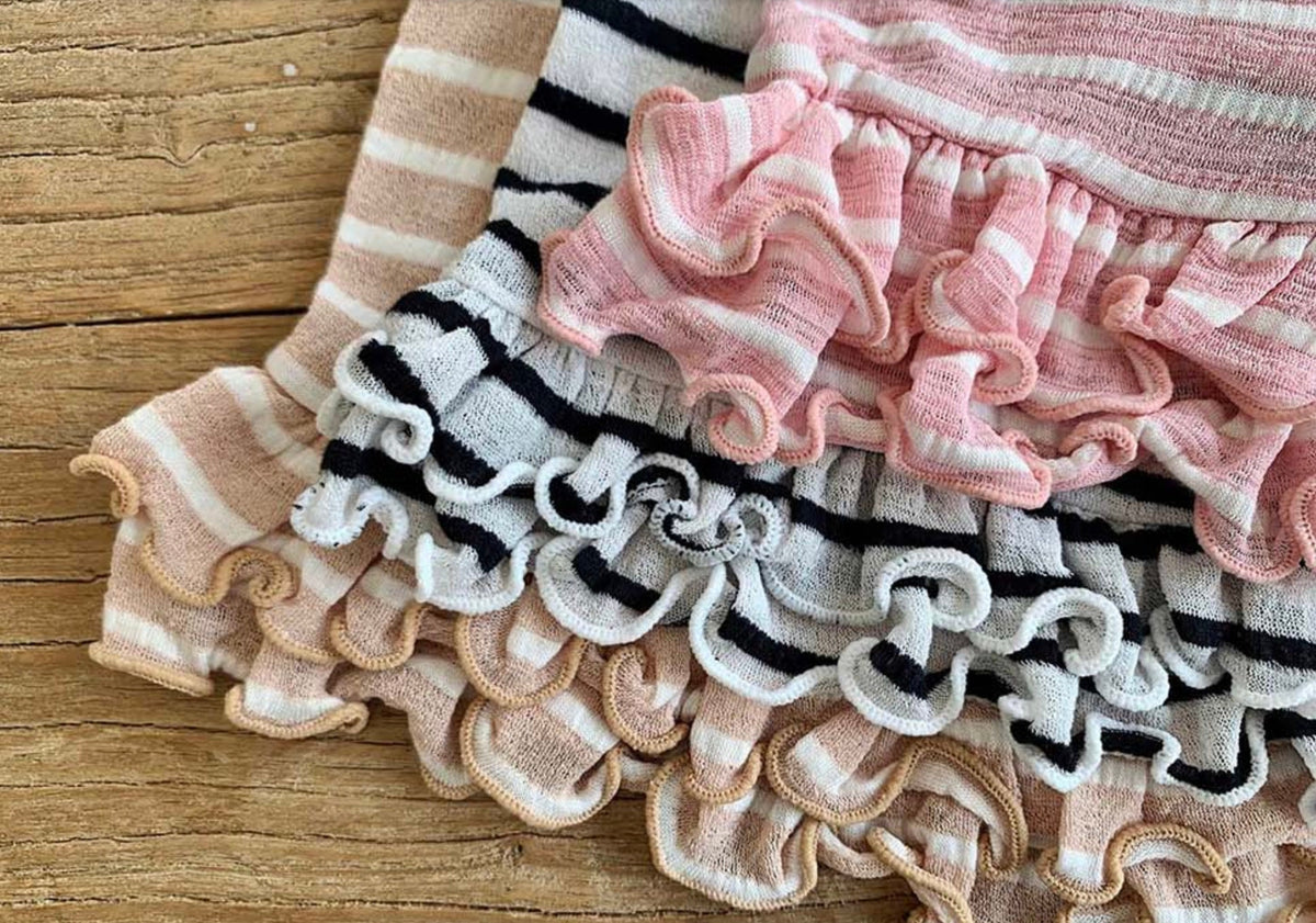 NKpup Stripe Crop Sleeveless Top dog shirt in pink, black, and tan ruffle patterns.