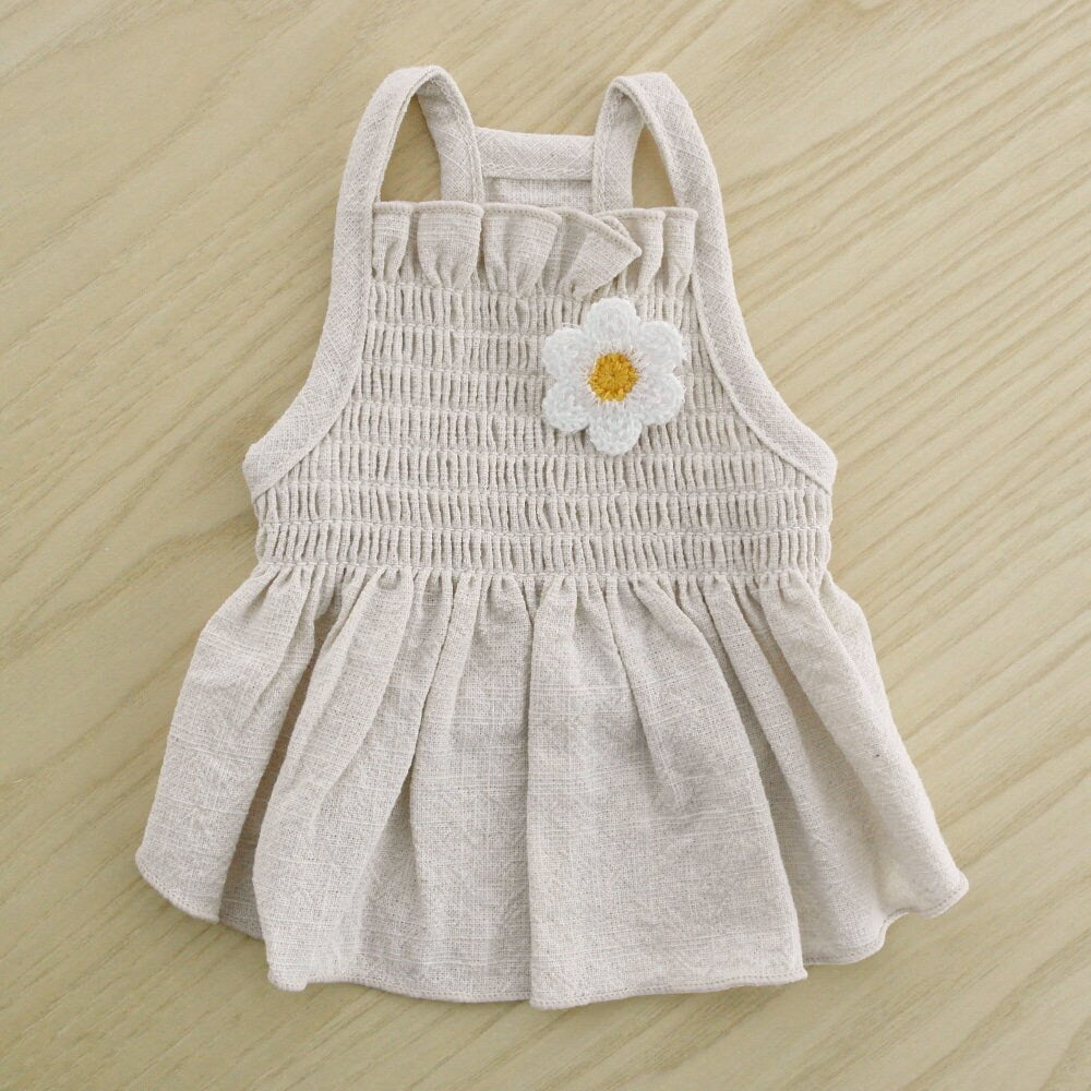 NKpup Linen Daisy Smocked Dog Dress in beige with a white daisy flower applique