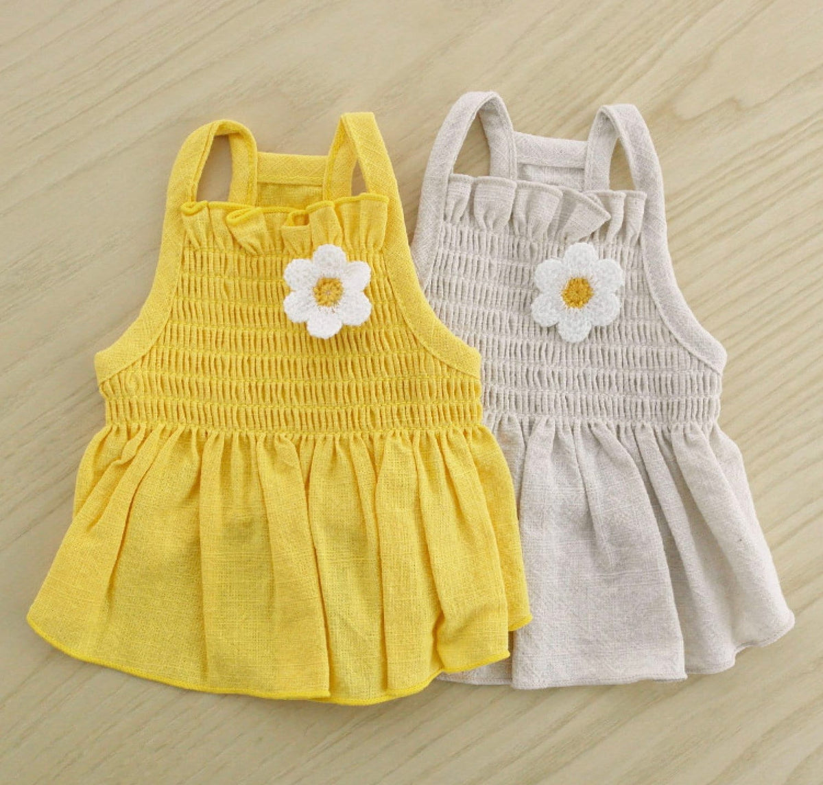 Yellow and beige linen daisy smocked dog dresses with floral applique.