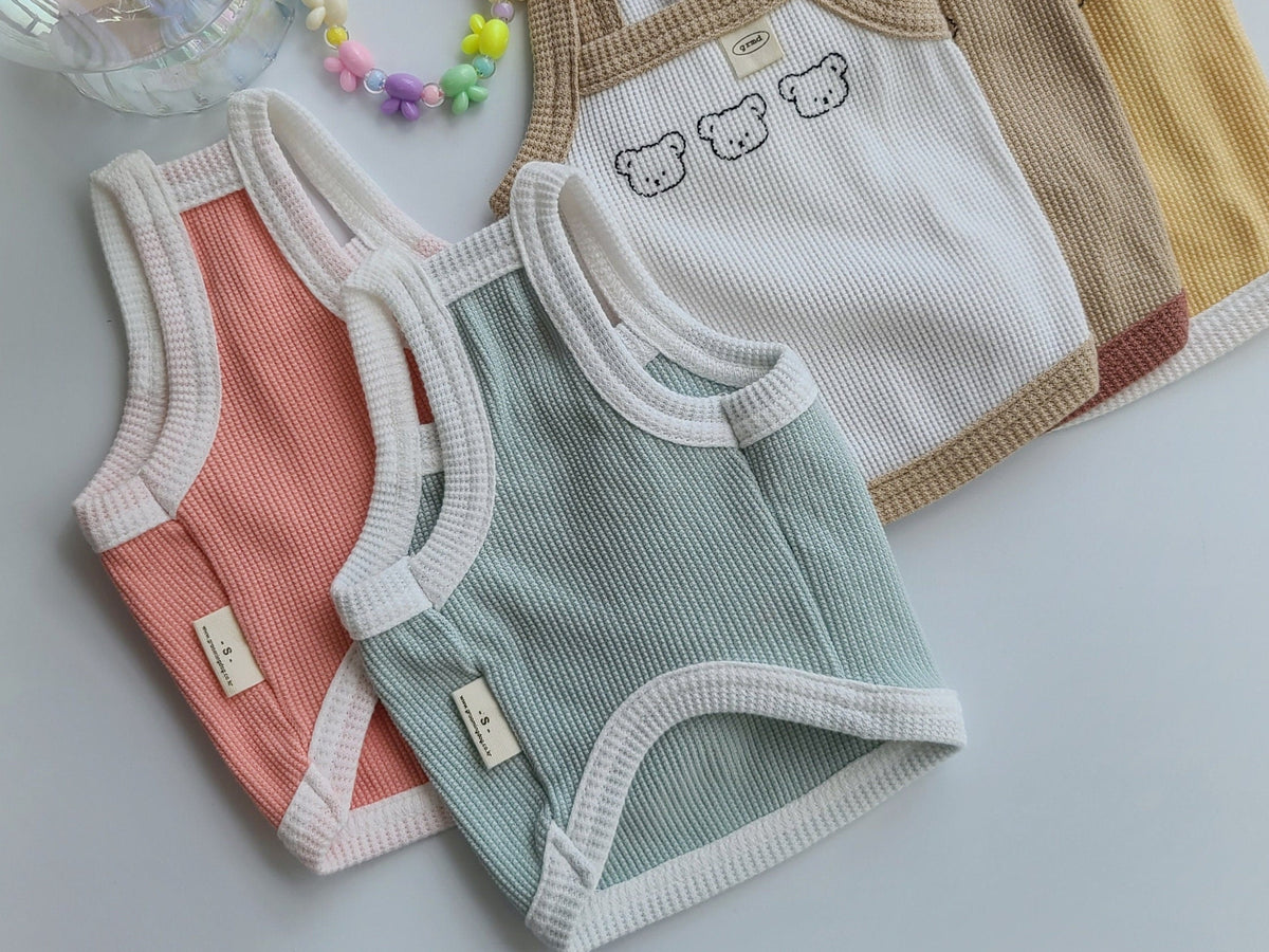 NKpup Waffle Bear Crop Tops for dogs in peach, sage green, white with bear embroidery, and tan.