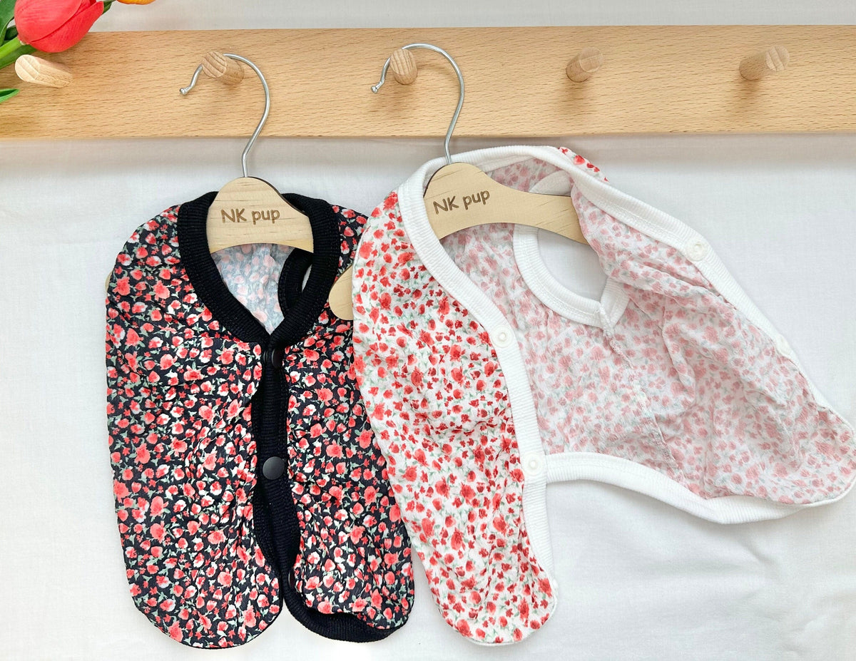 NKpup mini floral dog vests in black and white with red floral patterns.