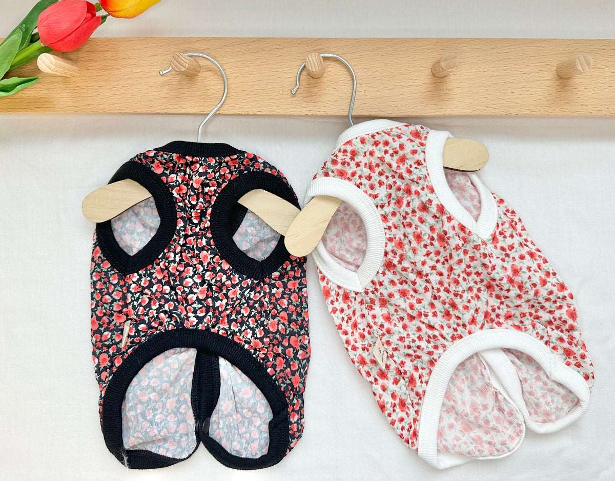 NKpup mini floral dog vests in black and white with red floral patterns.