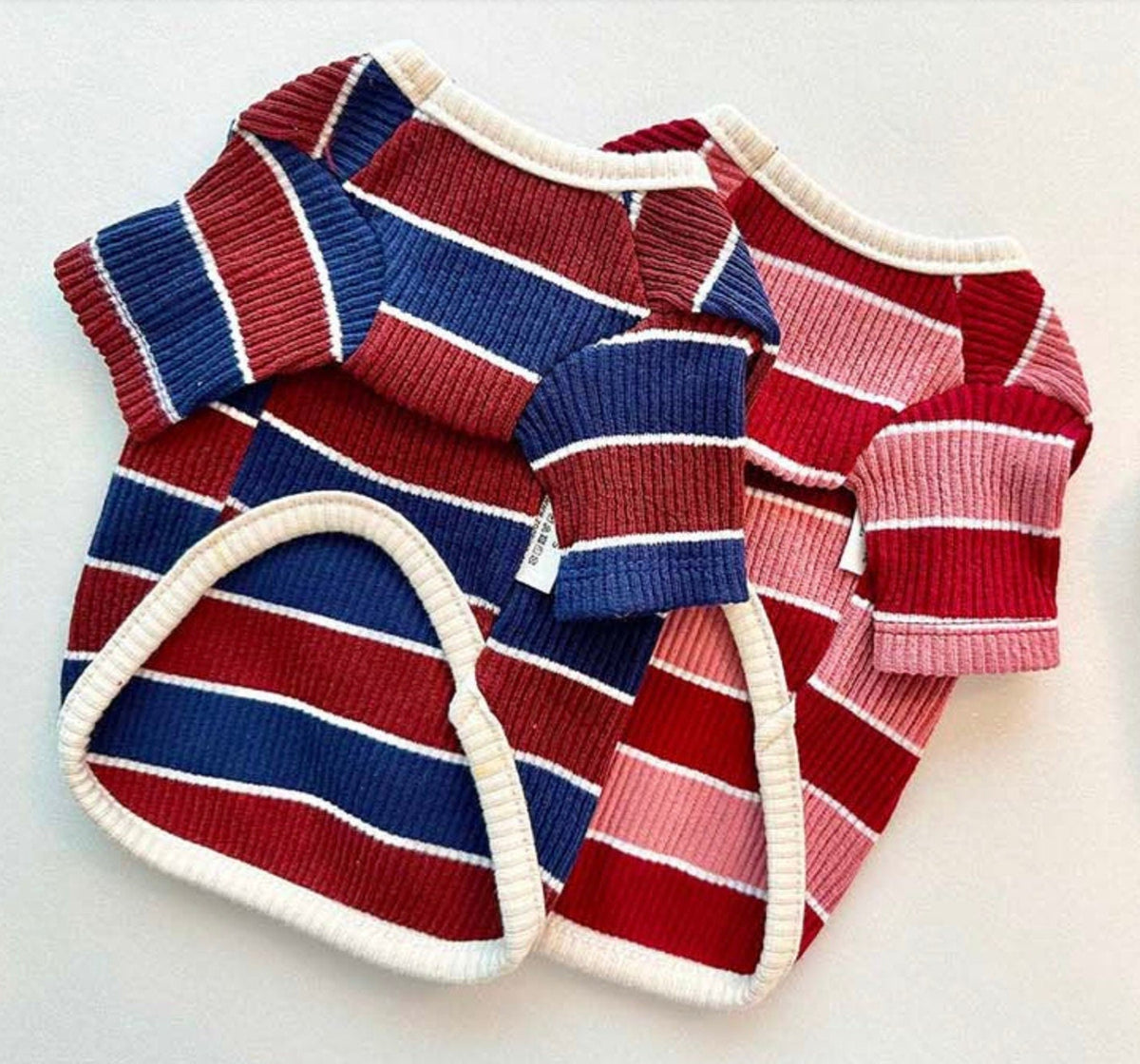 Joy Striped Dog T-Shirts in red, blue, and pink ribbed patterns.