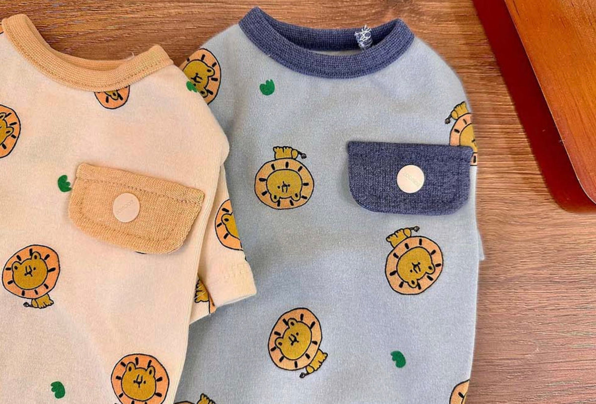 NKpup lion print dog shirts in cream and light blue with front chest pockets