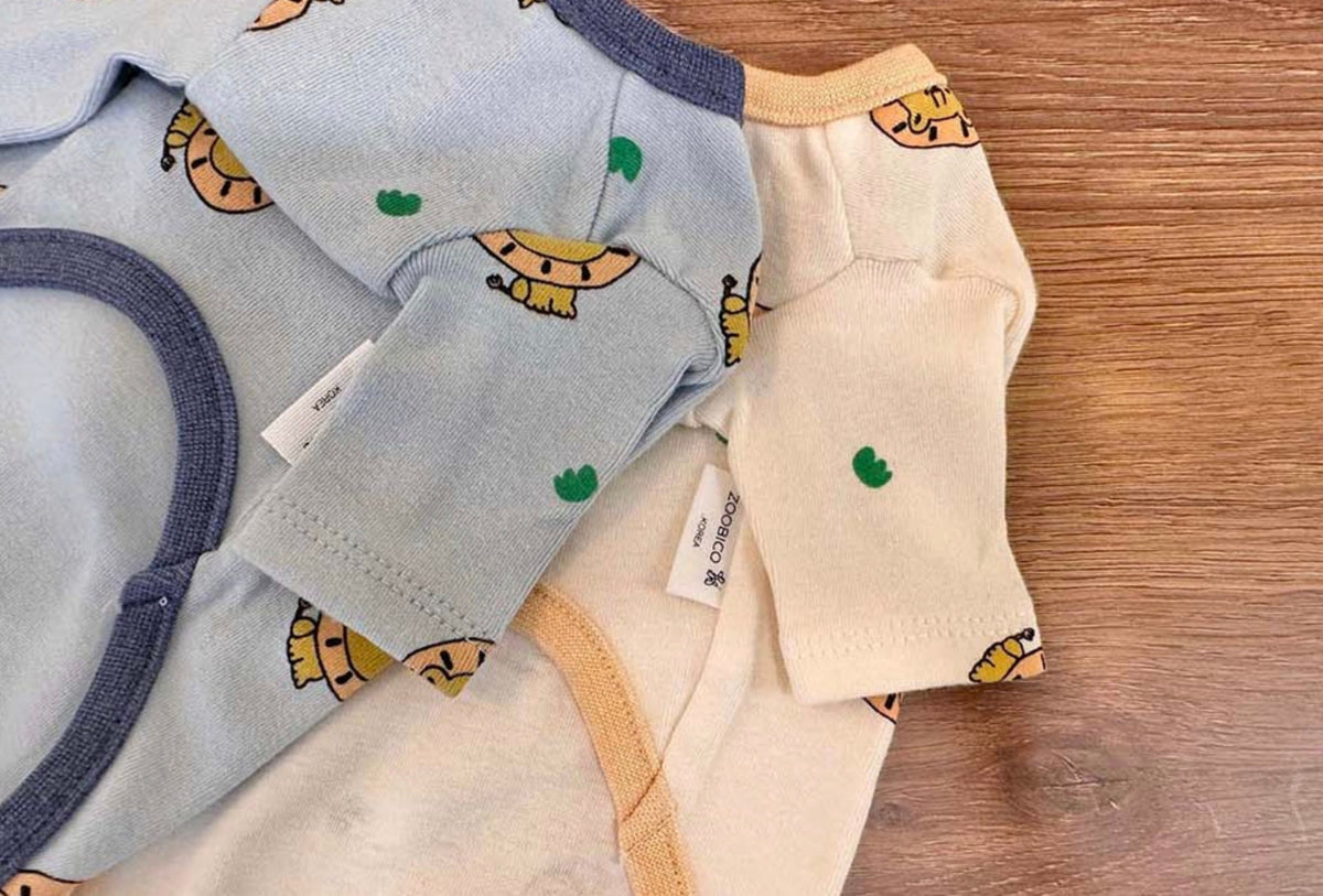 NKpup lion print dog shirts in light blue and cream colors