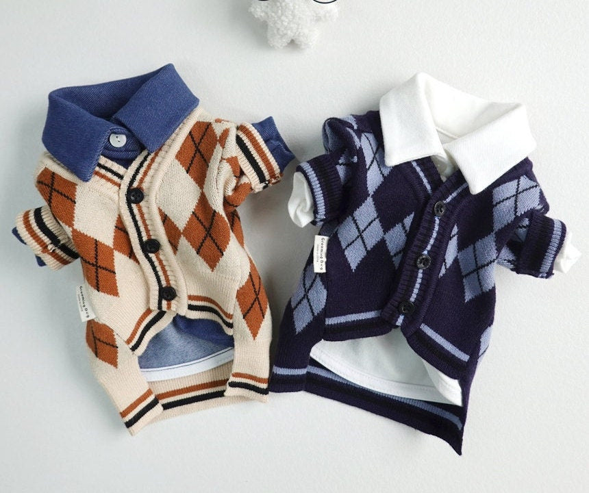 Two NKpup argyle knit dog cardigans in beige and navy blue with collared shirts.
