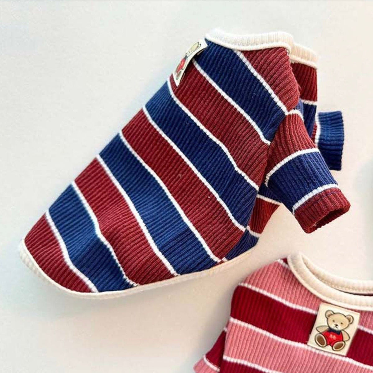 NKpup Joy Striped Dog T-Shirt in blue, red, and white stripes.