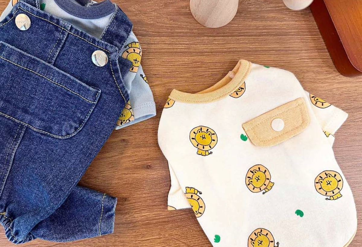 NKpup cream dog shirt with yellow lion print and a tan chest pocket