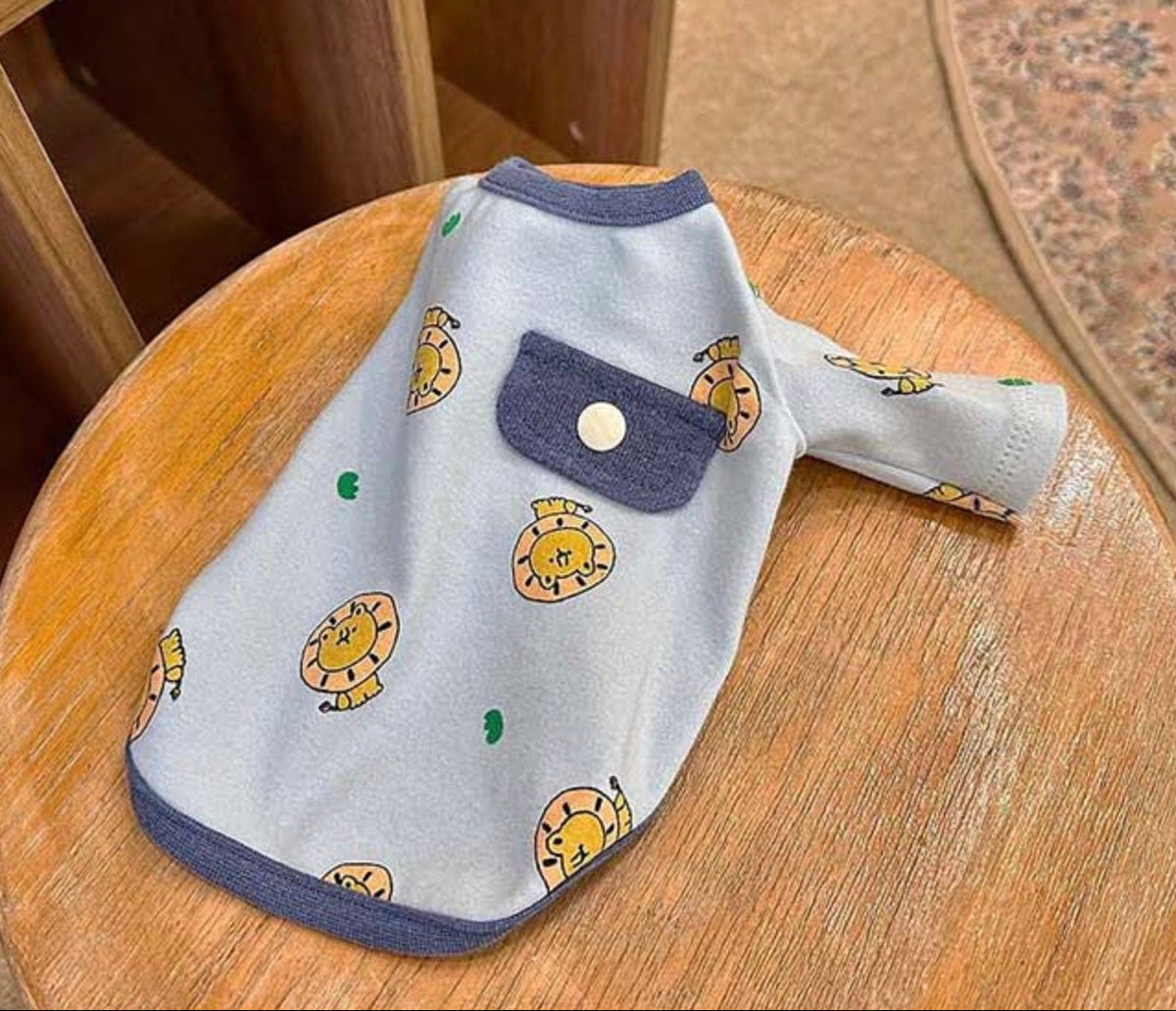 NKpup light blue dog shirt with yellow lion prints and a small chest pocket