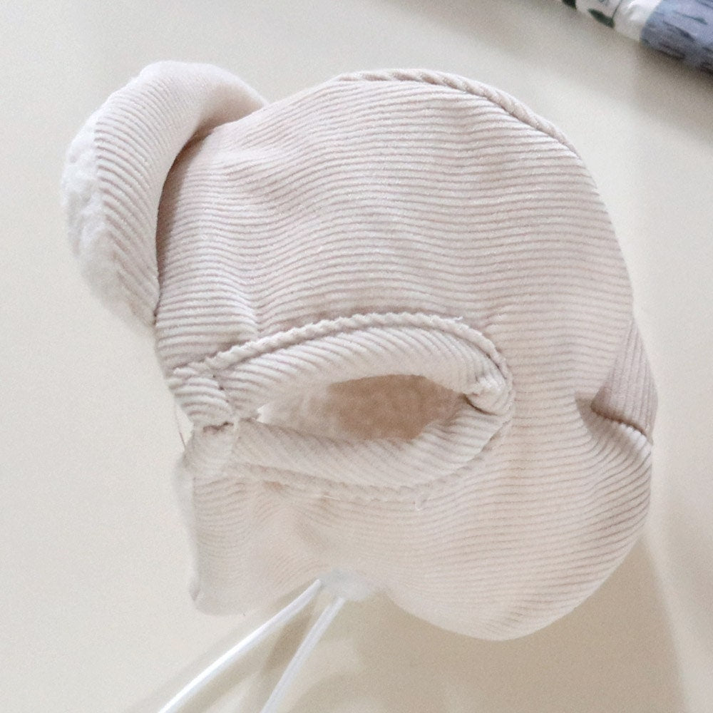 Cream-colored corduroy bomber hat for pets