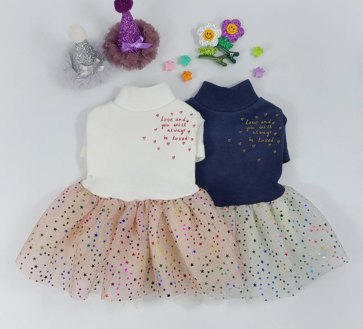White and navy blue Halloween dog tutu dresses with glittery star skirts and 'Love and you will always be loved' text