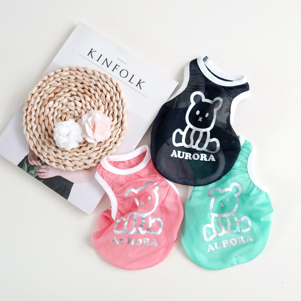 Aurora Mesh Sleeveless dog vests in black, pink, and mint green featuring a bear graphic.