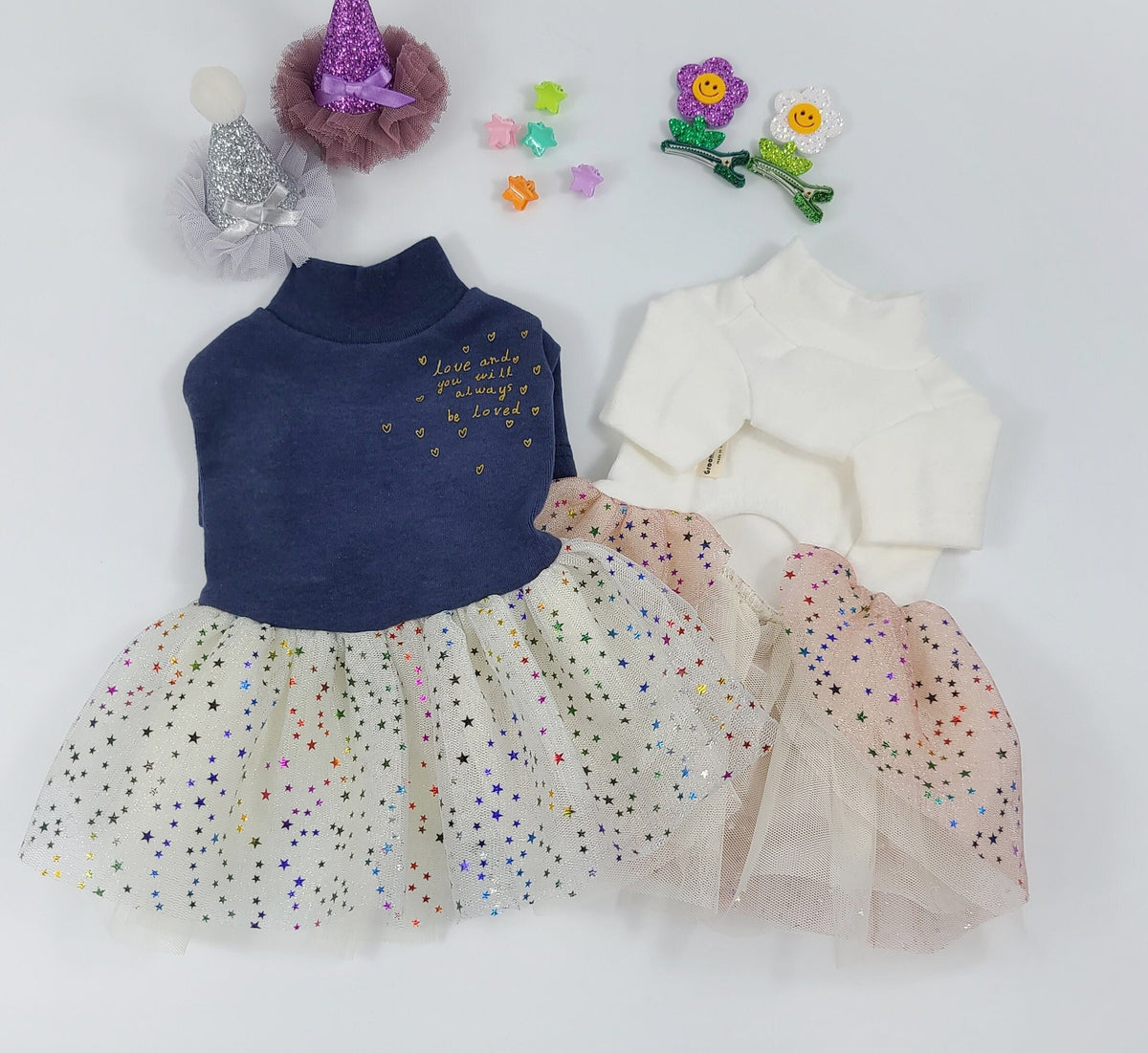 Navy blue and white Halloween dog tutu dresses with sparkling star-patterned tulle skirts.