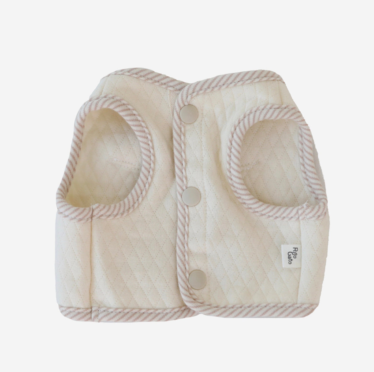 Cream organic quilted dog crop vest with ribbed trim and snap button closures.