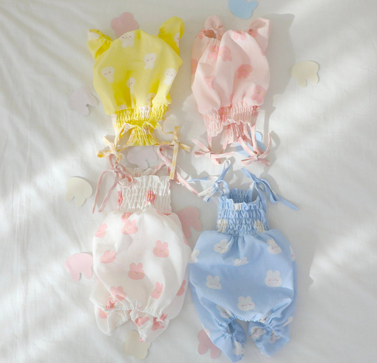NKpup Rabbit Dog Overalls in yellow, pink, white, and blue with bunny patterns