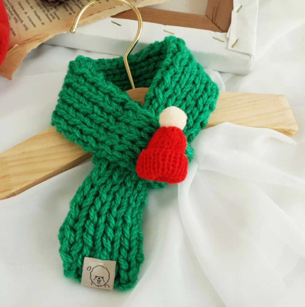 Green handmade knit Christmas dog scarf with a red pom-pom accent