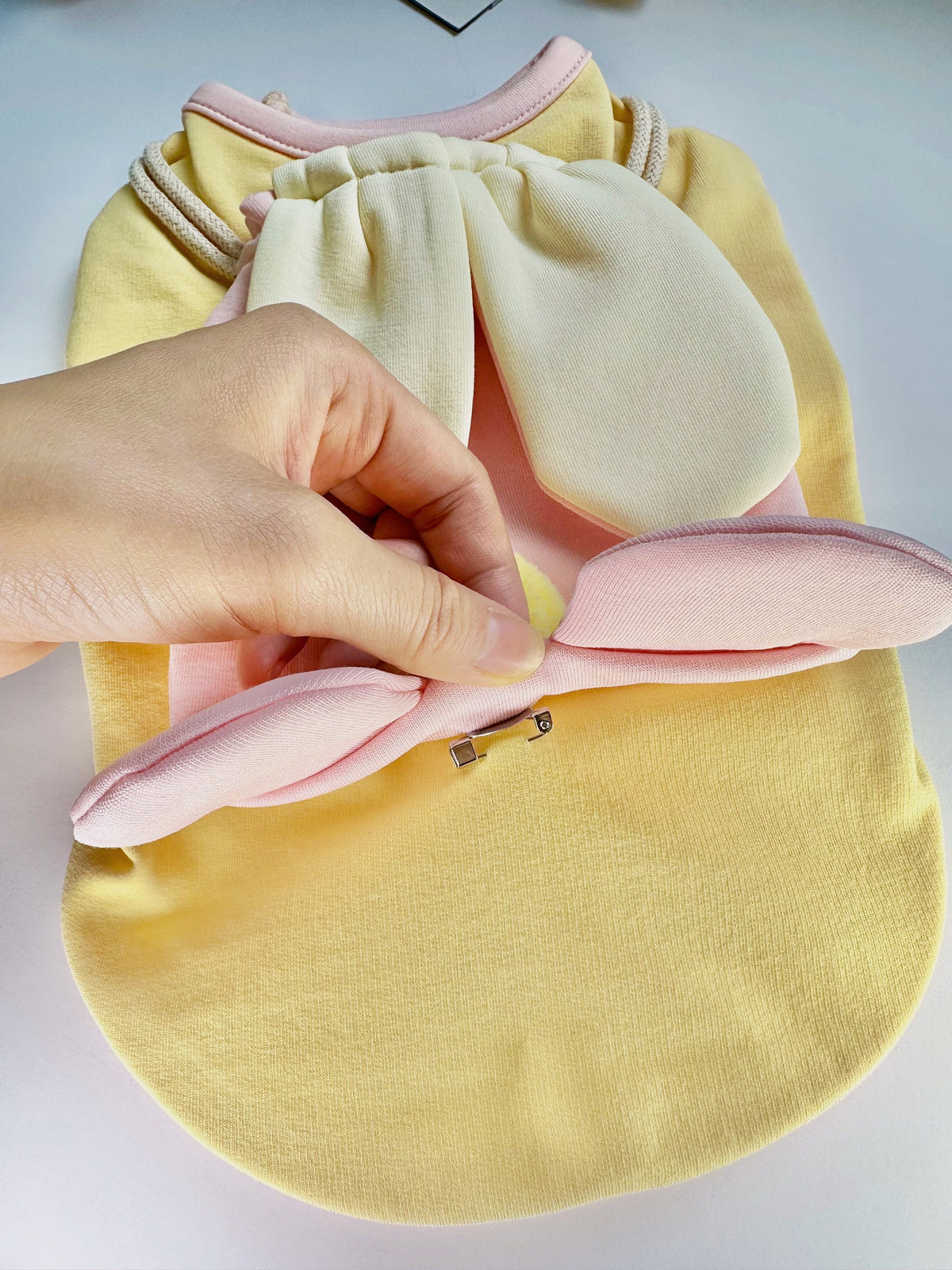 Yellow Bunny Bag dog shirt with soft pink bunny ear details