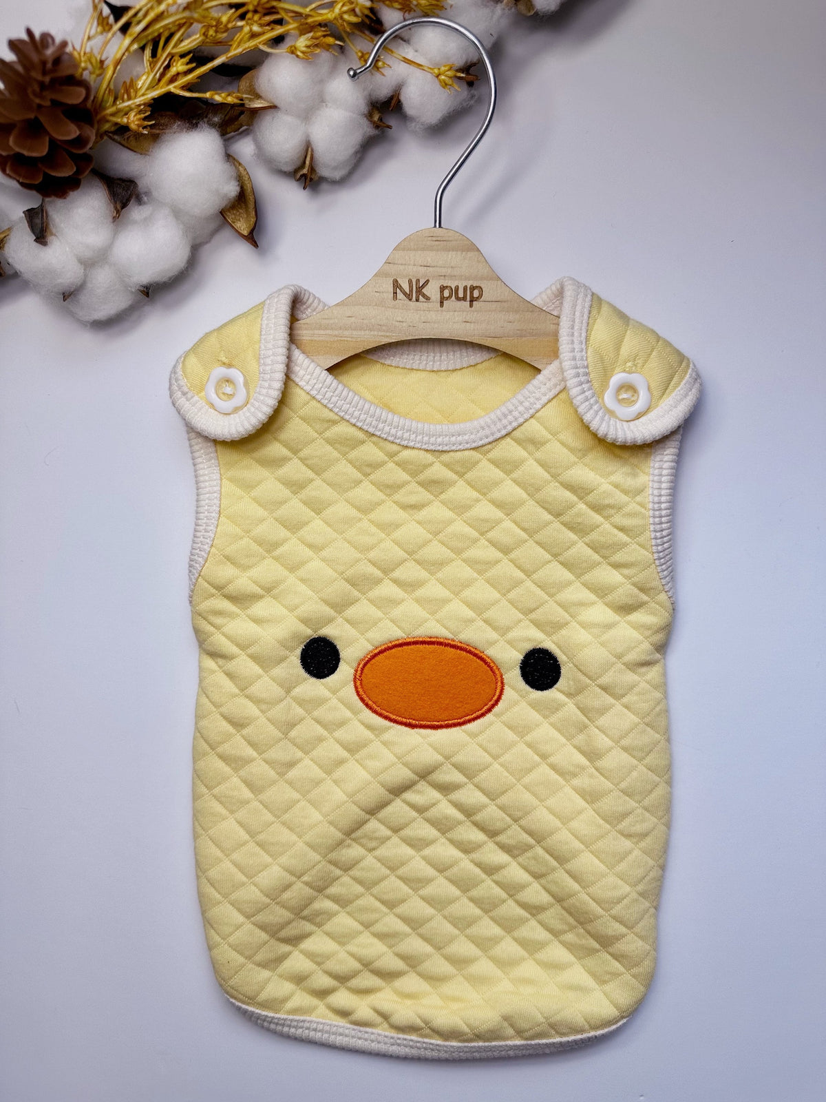 Zoo Cotton Quilted Dog Vest in pale yellow with a cute duck face design