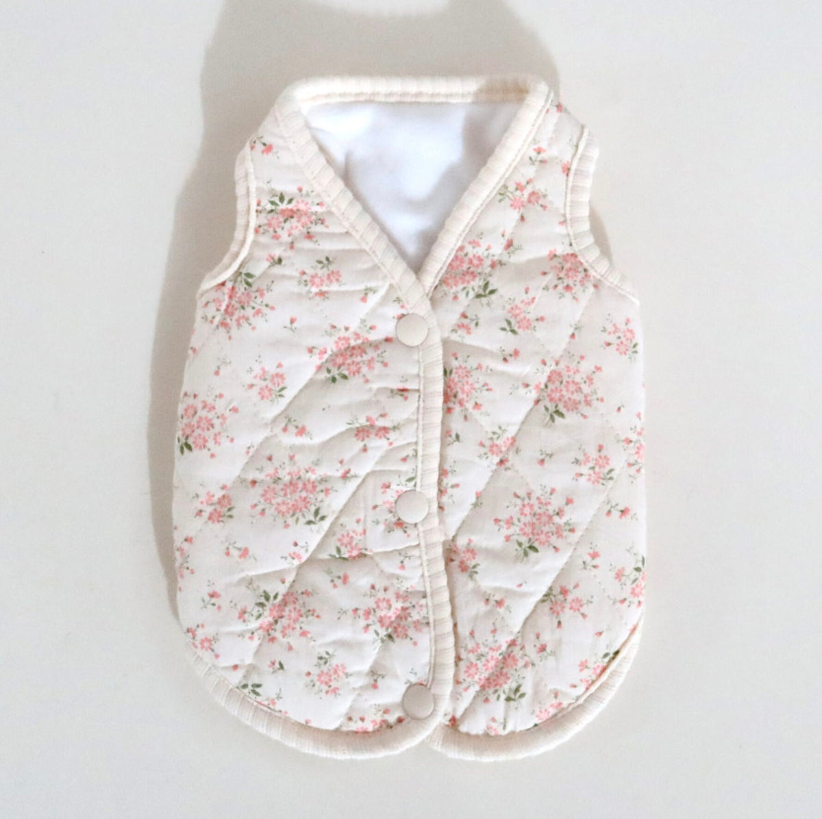 NKpup floral quilted dog vest in cream with pink flower pattern