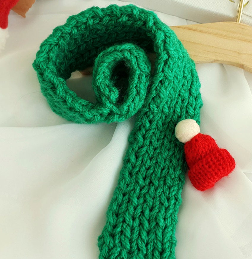Christmas handmade green knit dog scarf with a small red Santa hat accent by NKpup