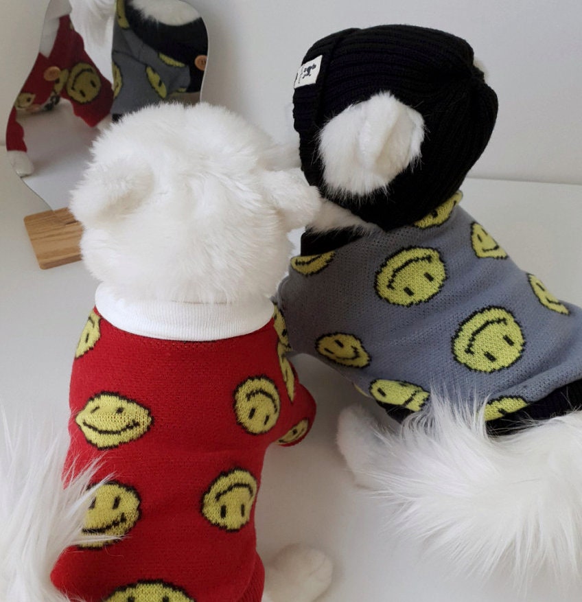 Red and grey smiley face pattern dog sweaters with a black ribbed cuff dog beanie by NKpup