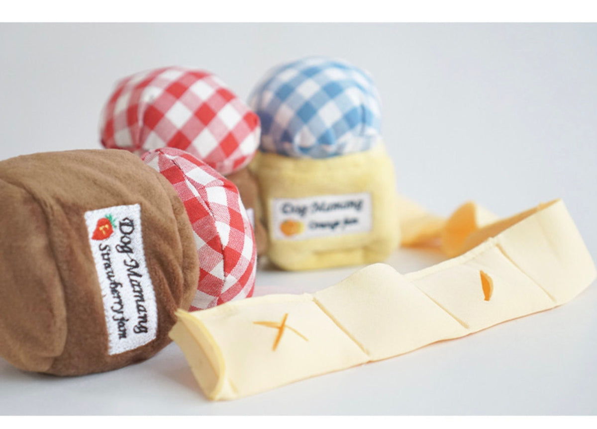 Snuffle Jam dog toys in red gingham and blue gingham patterns with cream fabric accents.